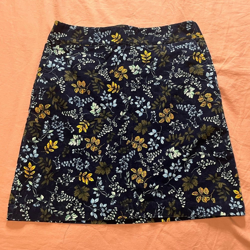 Talbots skirt, medium weight material, flowers on dark navy background. Size 8.